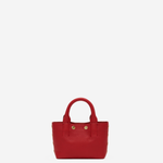 Small structured red tote bag with dual top handles and a compact, polished silhouette.