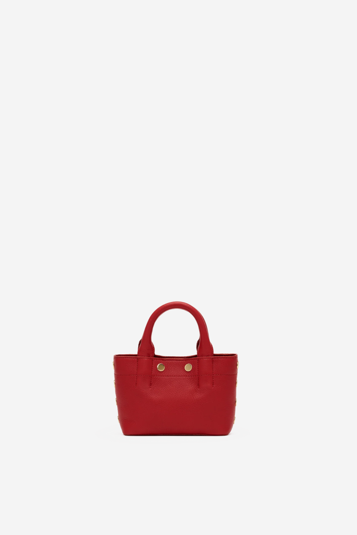 Small structured red tote bag with dual top handles and a compact, polished silhouette.