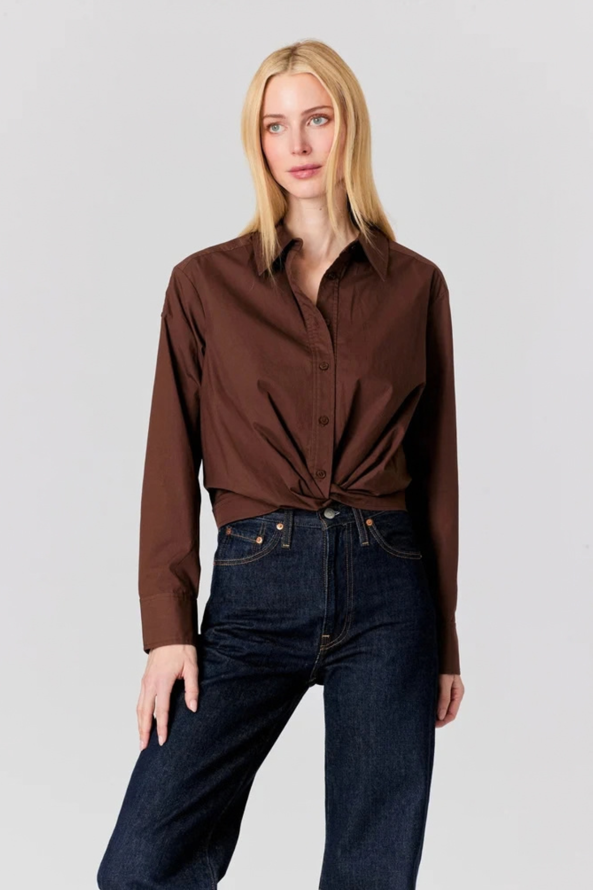 Women's navy long-sleeve top featuring a relaxed silhouette and classic neckline.