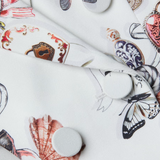 White ceramic plates with colorful butterfly designs on a white background