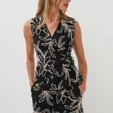Woman wearing a black floral top