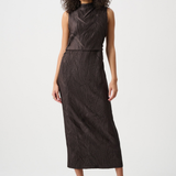 Woman wearing a dark brown dress on a white background
