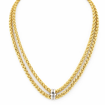 Gold chain necklace with a silver clasp on a white background