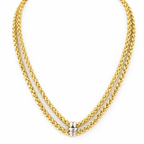 Gold chain necklace with a silver clasp on a white background