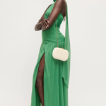 Woman wearing a green dress with a white background