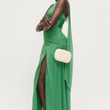 Woman wearing a green dress with a white background