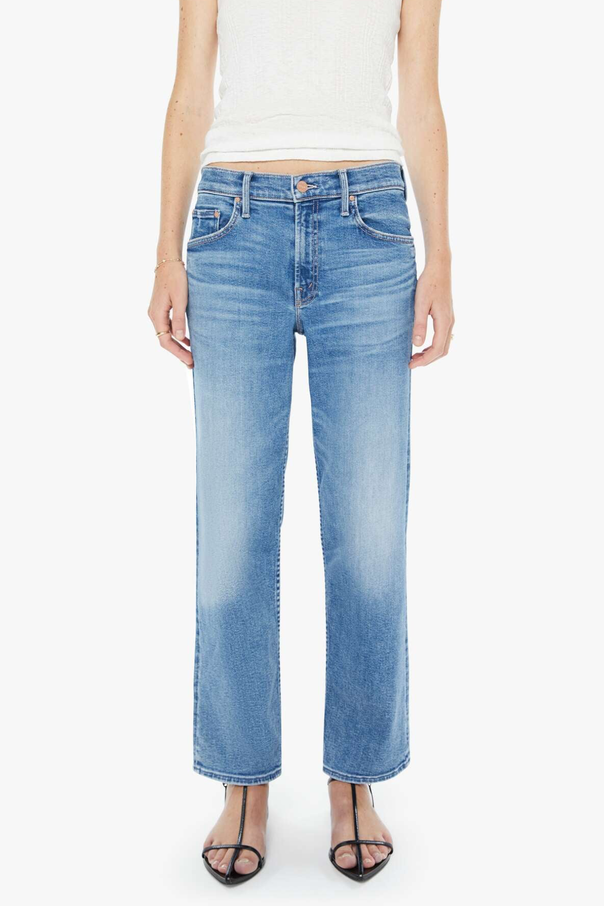 Light blue jeans worn by a person on a white background