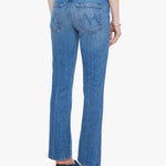 Woman wearing mid-wash cropped flare jeans with a slim upper fit and subtle kick-flare hem.