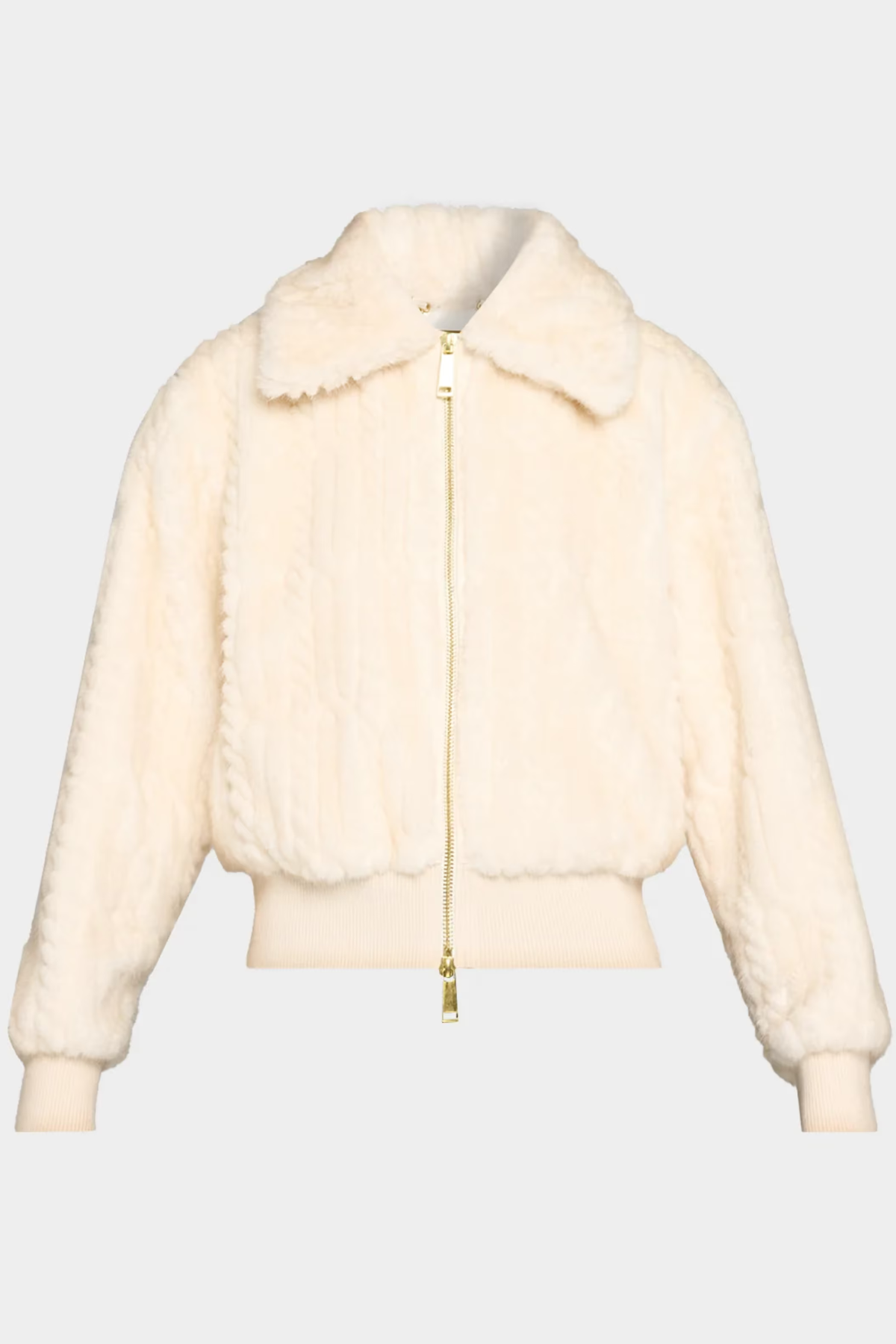 A cream-colored faux fur jacket with a gold zipper, shown against a light gray background.