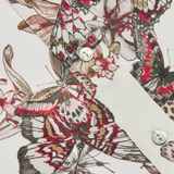 Close-up of a fabric with butterfly pattern on a white background