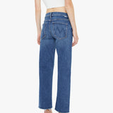 Person wearing blue jeans and a white crop top on a white background