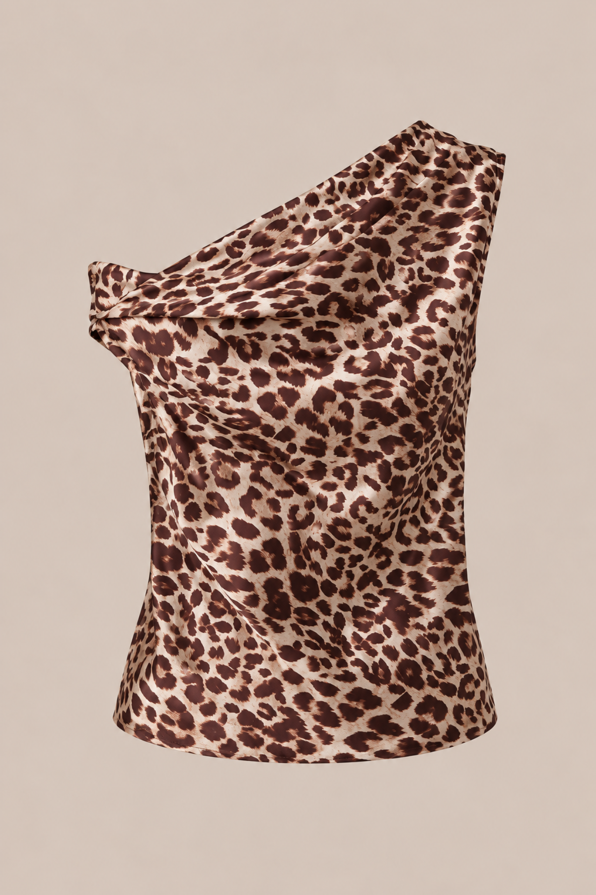 A one-shoulder leopard print top with a draped, gathered neckline, shown against a solid beige background.