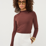 Women's brown long-sleeve turtleneck top featuring a fitted silhouette and classic high neckline.