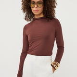 Women's brown long-sleeve turtleneck top featuring a fitted silhouette and classic high neckline.