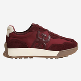 A low-top sneaker in burgundy suede and leather with a cream midsole and a brown gum outsole, shown from the side on a light gray background.