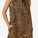 A sleeveless collared dress with a brown and black zebra print, featuring side pockets, shown on a model against a light gray background.