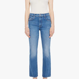 Woman wearing mid-wash cropped flare jeans with a slim upper fit and subtle kick-flare hem.