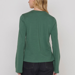 Women's green top featuring a keyhole neckline and feminine silhouette.