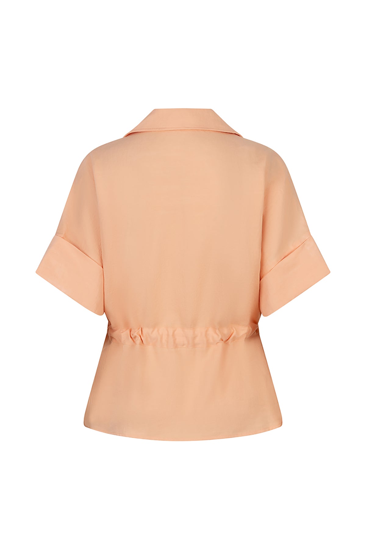 Light peach blouse with a belt on a white background