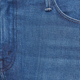 Woman wearing mid-wash flared jeans with a slim fit through the hip and gentle flare at the hem.