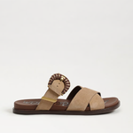 Beige sandal with lion head design on a white background