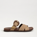 Beige sandal with lion head design on a white background