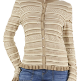 Beige patterned cardigan worn by a person on a white background