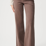 Brown pants worn by a person on a white background
