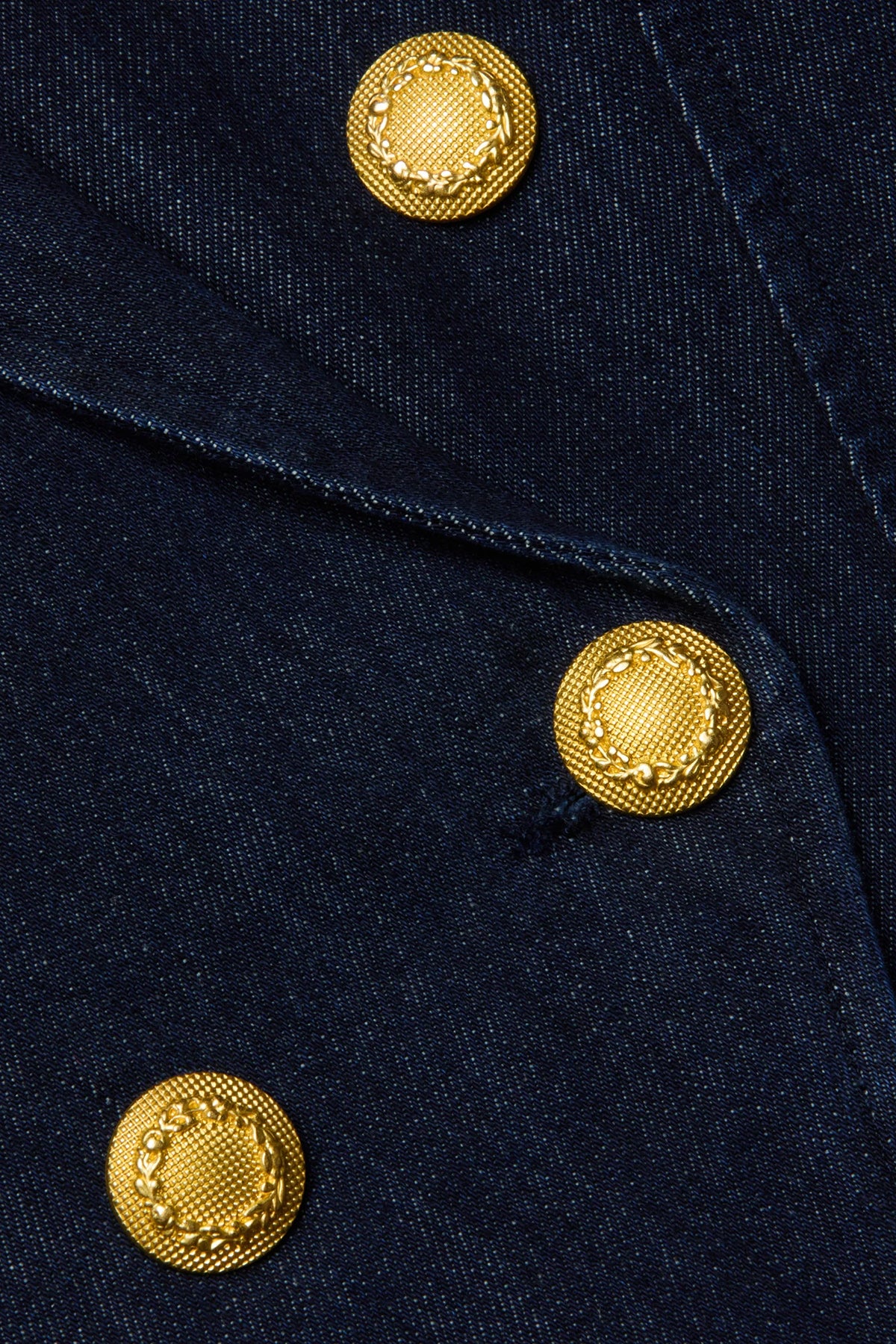 Navy structured blazer styled over a simple top.