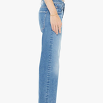 Person wearing light blue jeans on a white background