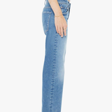 Person wearing light blue jeans on a white background