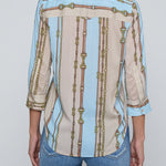 Three-quarter sleeve blouse with a soft stripe pattern.