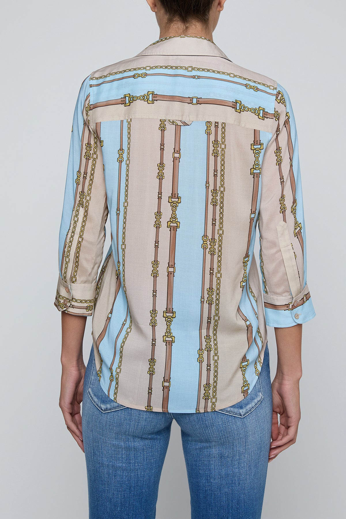 Three-quarter sleeve blouse with a soft stripe pattern.