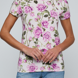 Model wearing rose print tee on a white background.