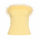 Yellow top with feather details on a white background
