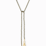 Necklace with gold pendants on a white background