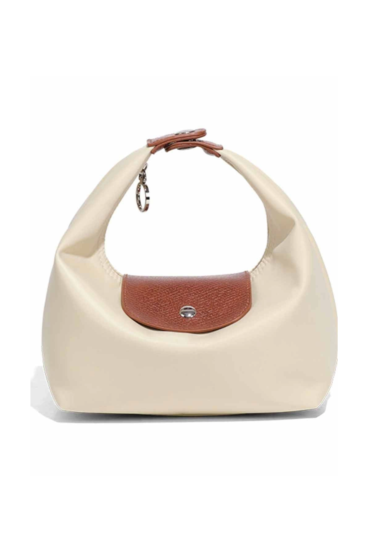 Beige handbag with brown leather patch on a white background