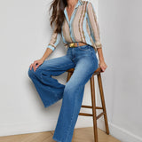 Three-quarter sleeve blouse with a soft stripe pattern.