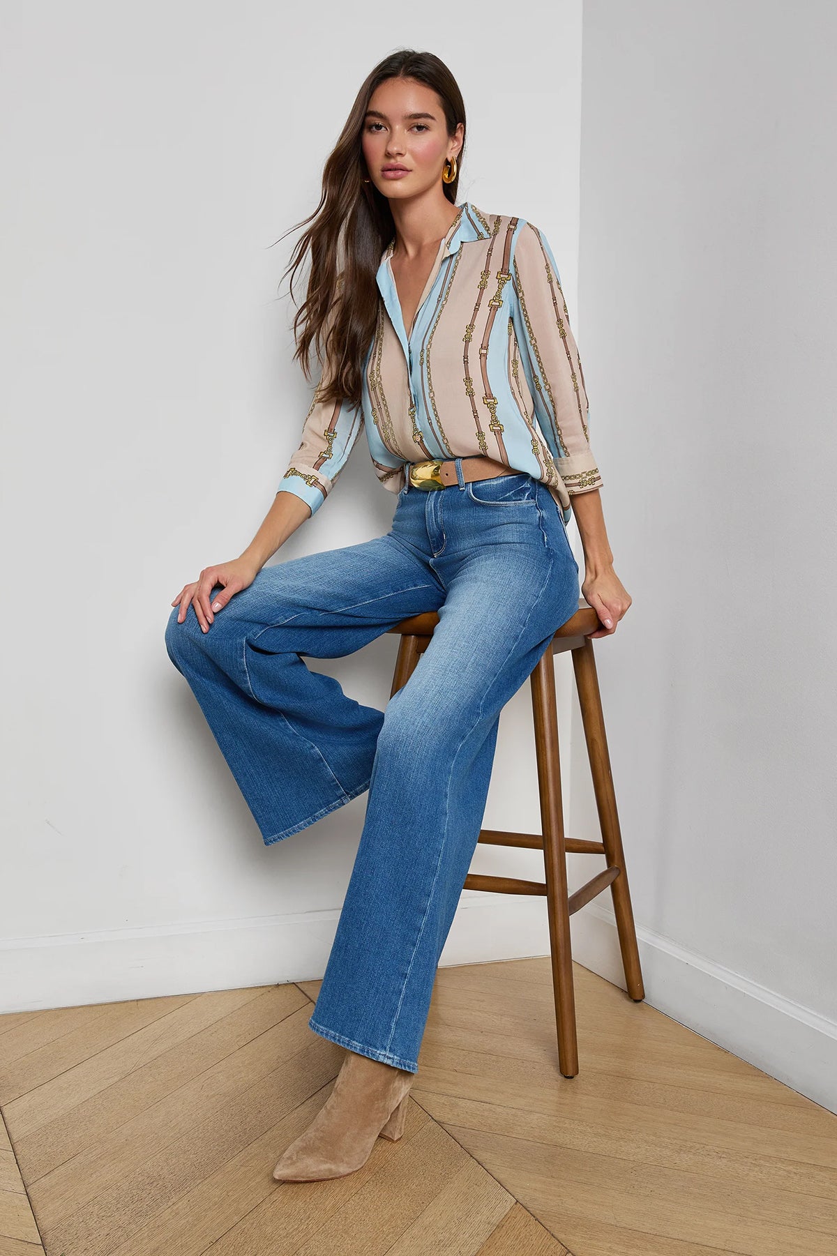 Three-quarter sleeve blouse with a soft stripe pattern.