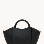 Black Hammitt Paul Mini crossbody bag worn with an evening outfit.