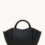 Black Hammitt Paul Mini crossbody bag worn with an evening outfit.