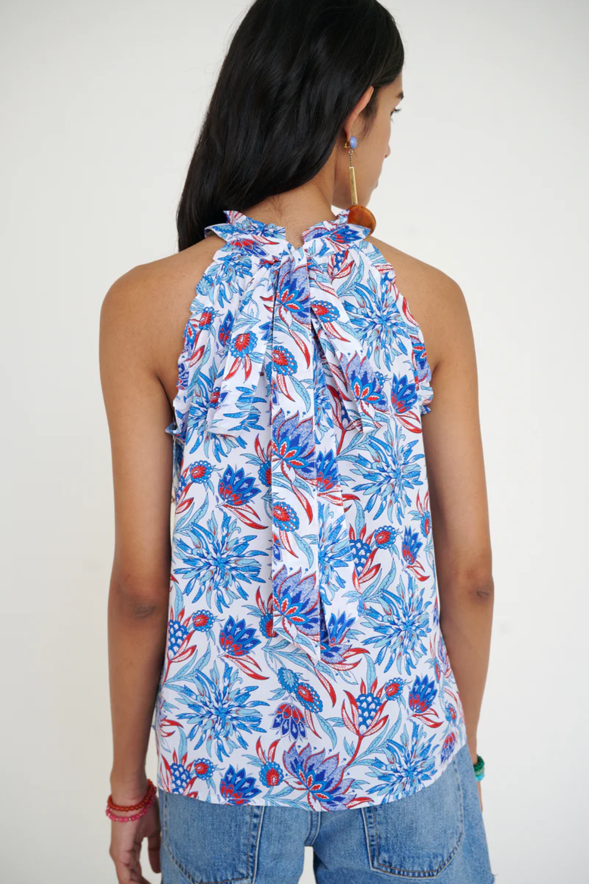 blue and red printed halter top modeled on white background