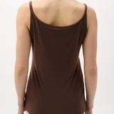 Brown tank top worn by a person on a white background
