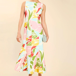 Woman wearing a colorful floral dress on a beige background