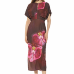 woman in large floral printed midi dress on white background 