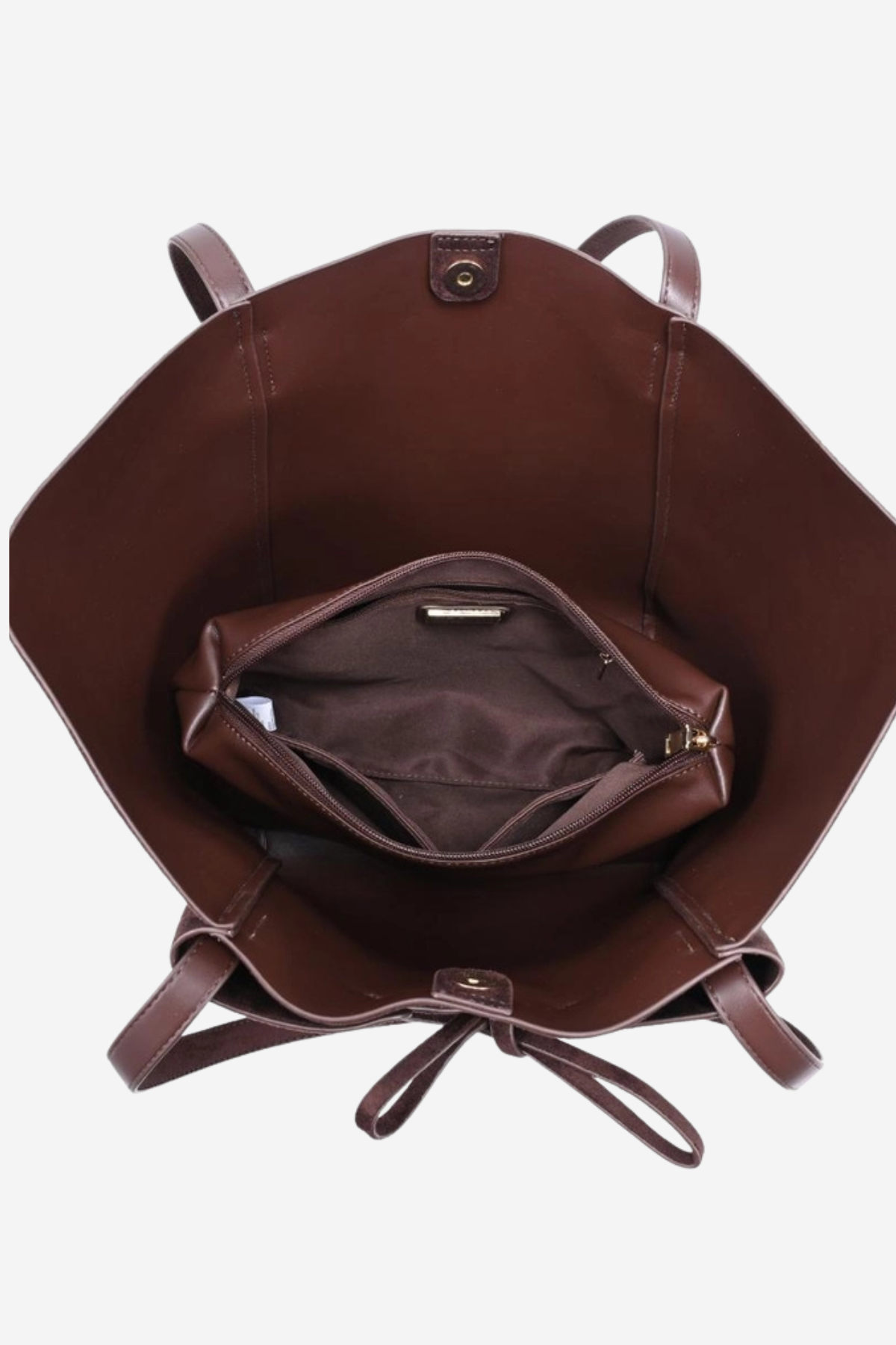 A brown leather tote bag shown from a top-down view, displaying its interior with a main compartment, a zippered pocket, and a drawstring closure on a light gray background.