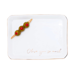 A white rectangular ceramic serving platter with rounded corners, featuring a thin gold rim, the phrase 'Olive you so mail' in gold cursive script near the bottom, and a decorative olive skewer on the top left.