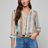 Three-quarter sleeve blouse with a soft stripe pattern.