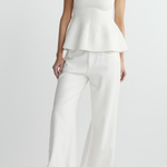 woman in white outfit on white background 