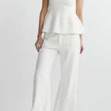 woman in white outfit on white background 